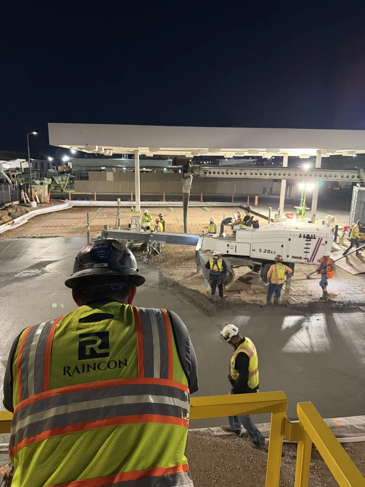 Raincon team overlooking a large concrete project