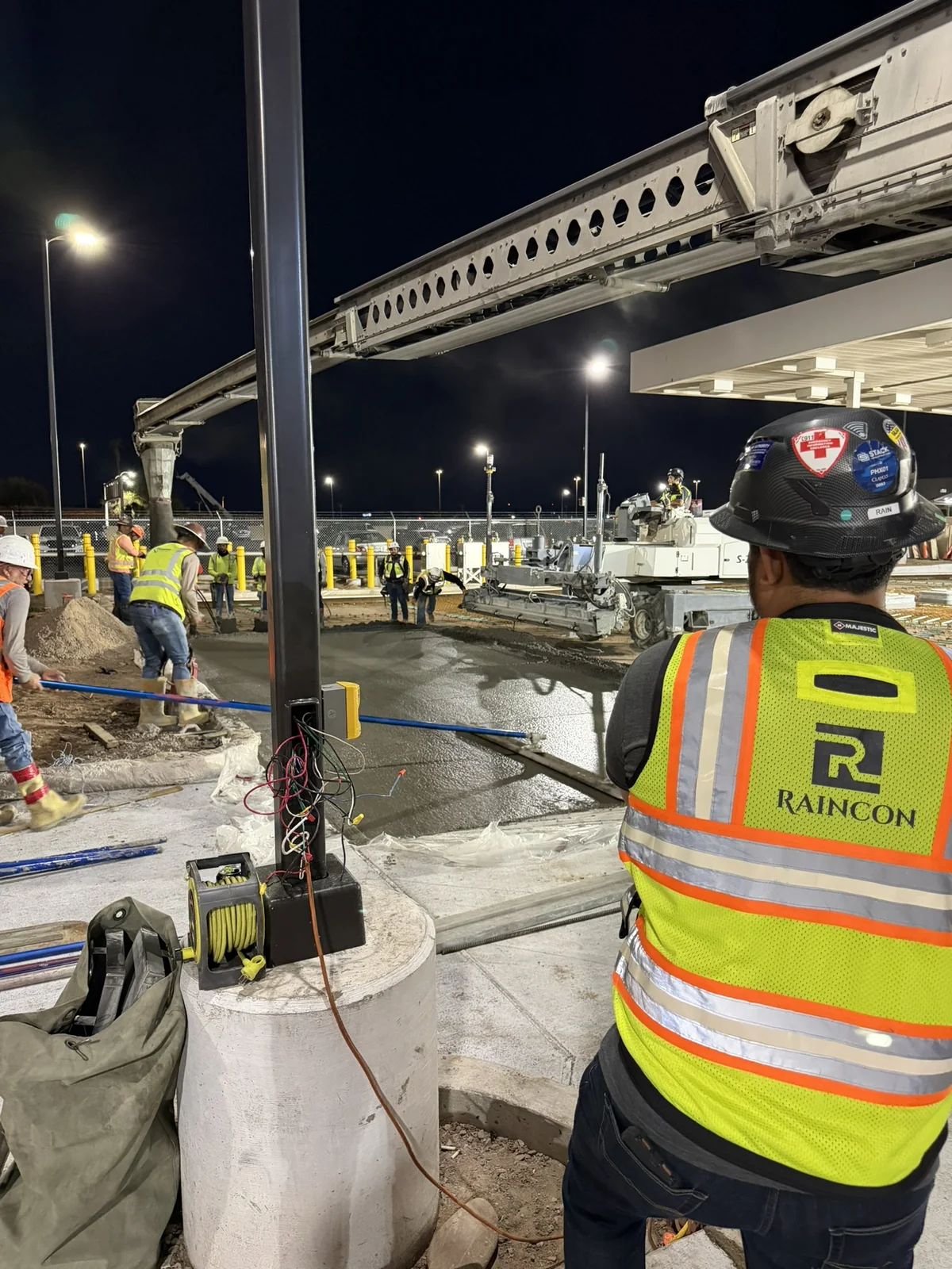Raincon crew member at a nighttime concrete project